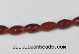 CAA124 15.5 inches 6*10mm faceted rice red agate gemstone beads