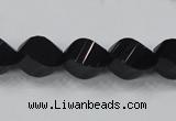 CAB336 15.5 inches 10*14mm faceted & twisted rice black agate beads