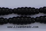 CAG1695 15.5 inches 10*30mm carved rice black agate beads