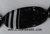 CAG3086 15.5 inches 25*50mm faceted oval black line agate beads