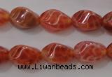 CAG4184 15.5 inches 6*10mm twisted rice natural fire agate beads