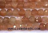 CCU885 15 inches 4mm faceted cube sunstone beads