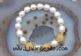 CFB928 9mm - 10mm rice white freshwater pearl & honey jade stretchy bracelet