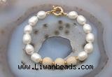 CFB946 Hand-knotted 9mm - 10mm rice white freshwater pearl & white fossil jasper bracelet