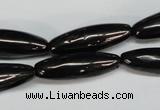 CJB54 15.5 inches 10*30mm rice natural jet gemstone beads