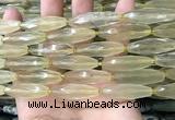 CRI132 15.5 inches 10*30mm faceted rice lemon quartz beads