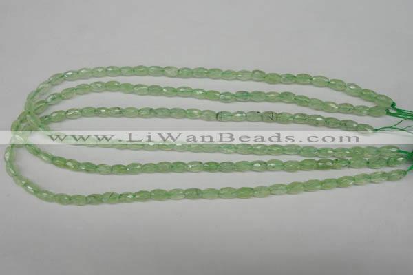 CRU165 15.5 inches 5*8mm faceted rice green rutilated quartz beads