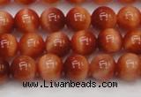 CTE1661 15.5 inches 6mm round sun orange tiger eye beads