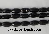 CTO116 15.5 inches 5*10mm faceted rice black tourmaline beads