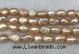 FWP290 15 inches 10mm - 11mm baroque pink freshwater pearl strands